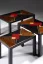 Gaston SUISSE (1896-1988) - Suite de trois tables gigognes en laque noire, 1936